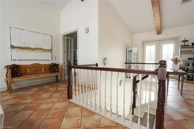 a view of a porch with wooden floor and furniture