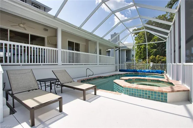 a view of a chairs and table in the patio