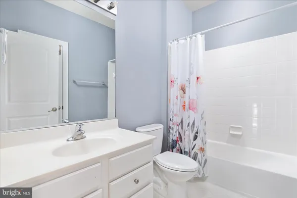 a bathroom with a sink a toilet and a bathtub