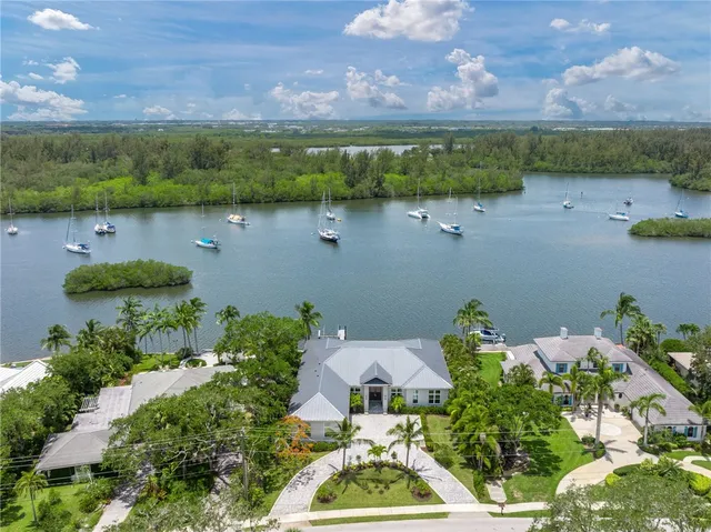 an aerial view of a house with a lake view