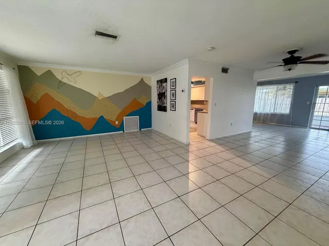 a view of an empty room and window