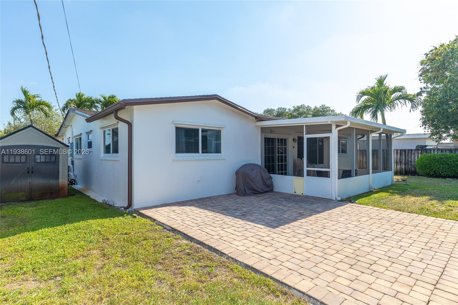 9181 Southwest 55th Street Cooper City, FL 33328 - Photo 5 of 7 a front view of house with yard and seating space