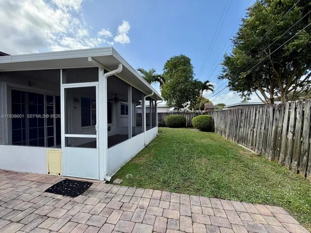 a view of a back yard of the house