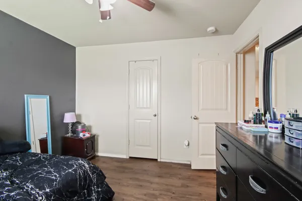 a bedroom with a bed and a table