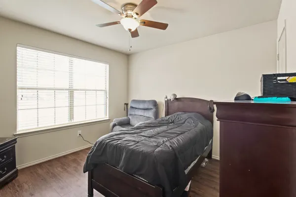 a bed room with a bed and a window