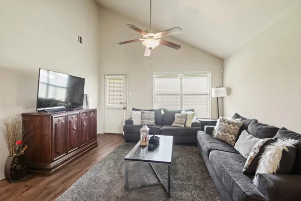 a living room with furniture and a flat screen tv
