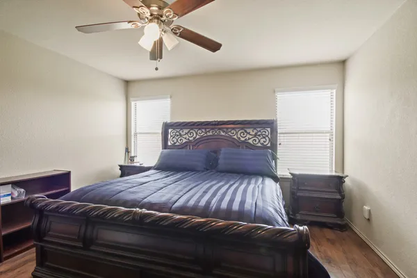 a bedroom with a bed and window