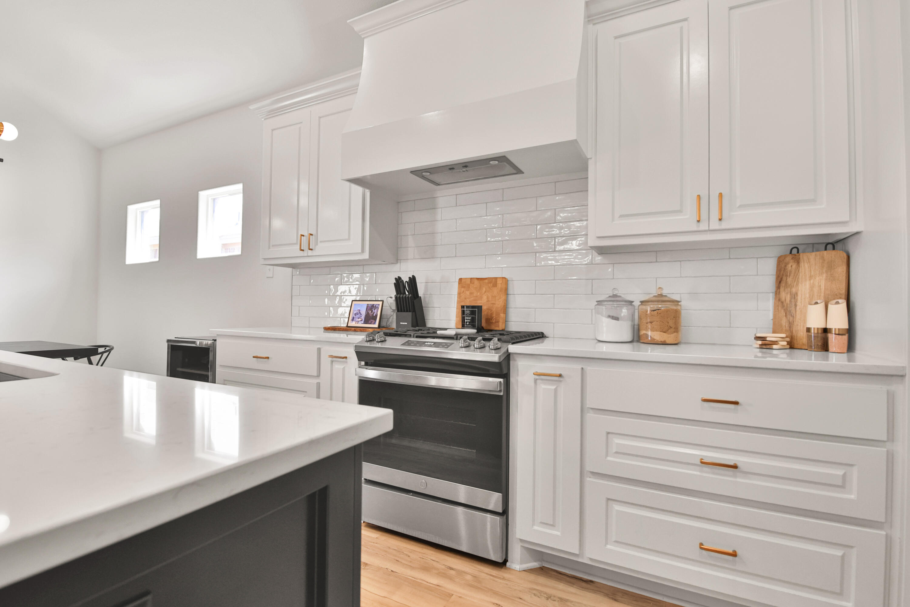 3706 144th Street Lubbock, TX 79423 - Photo 12 of 36 a kitchen with cabinets appliances a sink and a counter space