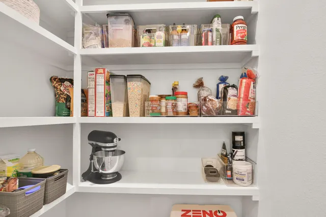 a shelf with books and knick knacks on it