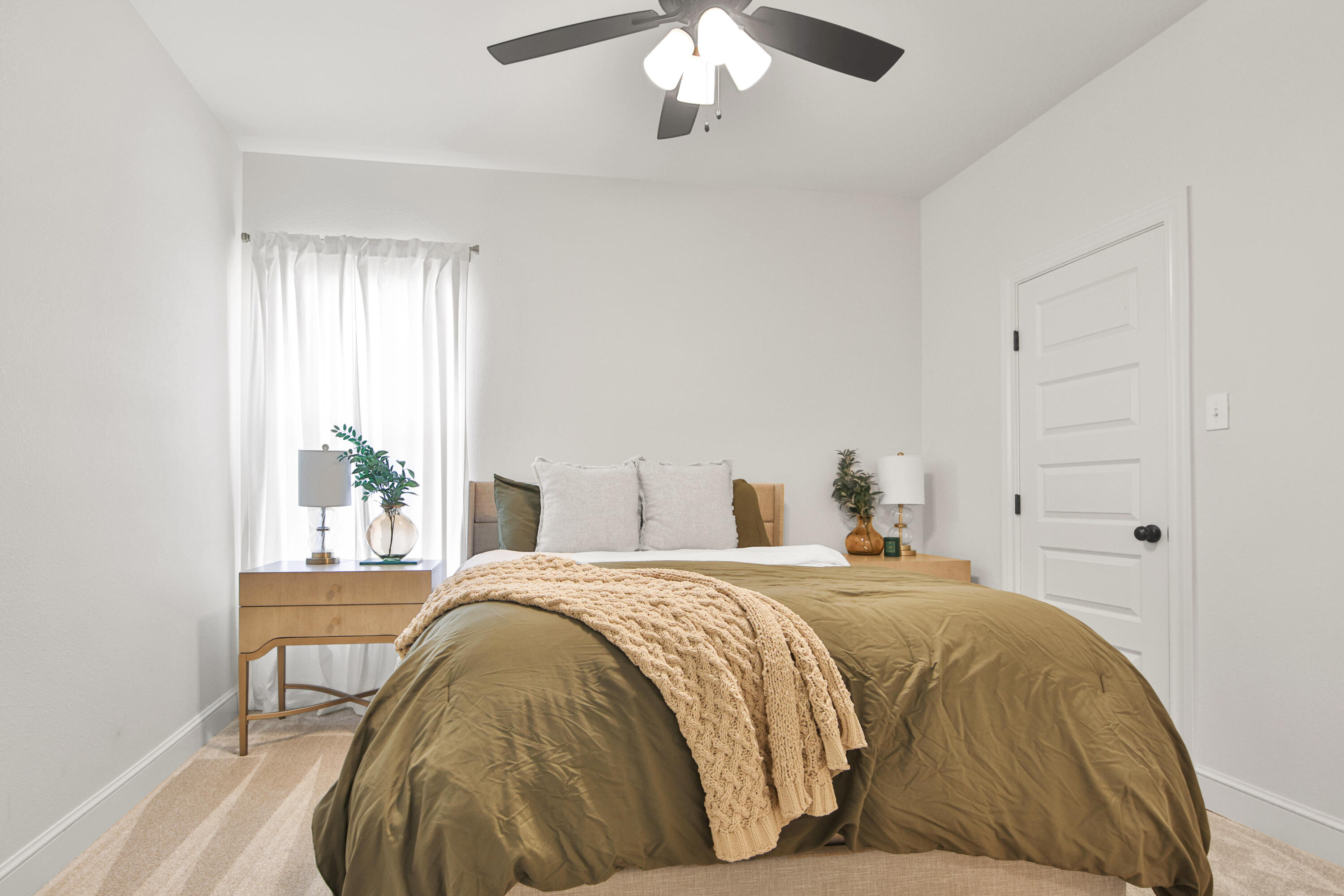 3706 144th Street Lubbock, TX 79423 - Photo 23 of 36 a bedroom with a bed and a chandelier