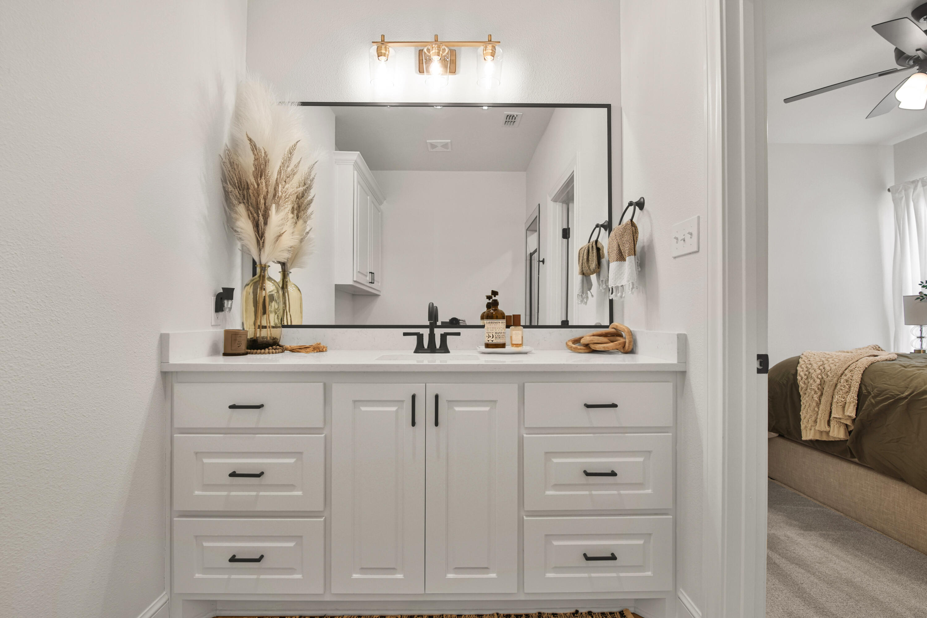 3706 144th Street Lubbock, TX 79423 - Photo 26 of 36 a bathroom with vanity mirror and view