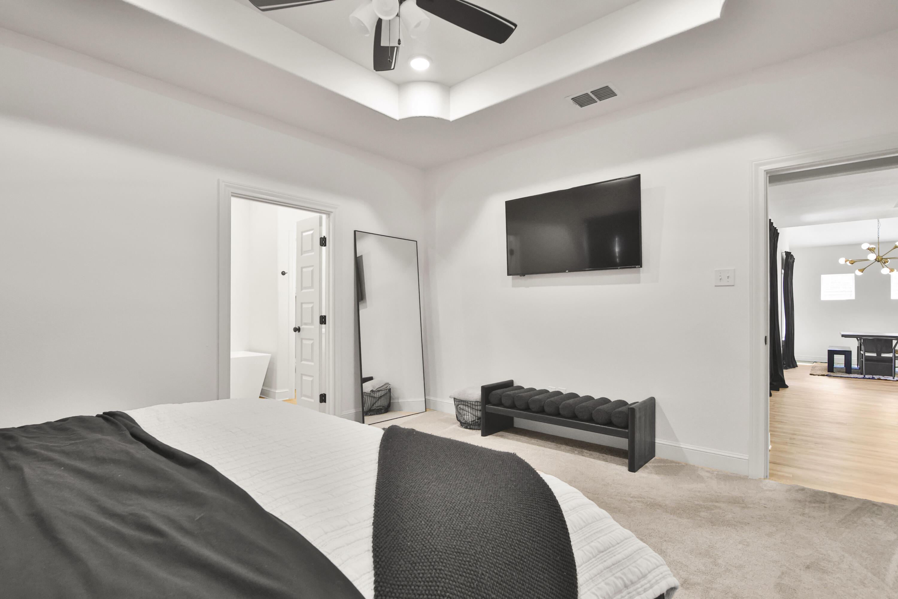 3706 144th Street Lubbock, TX 79423 - Photo 29 of 36 a bedroom with a bed and a flat screen tv