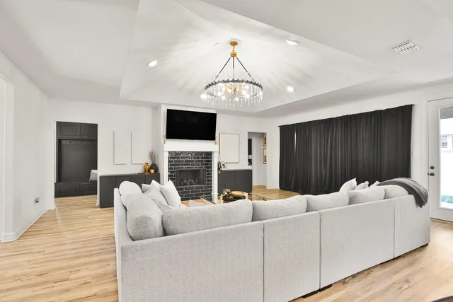 a living room with furniture and a fireplace