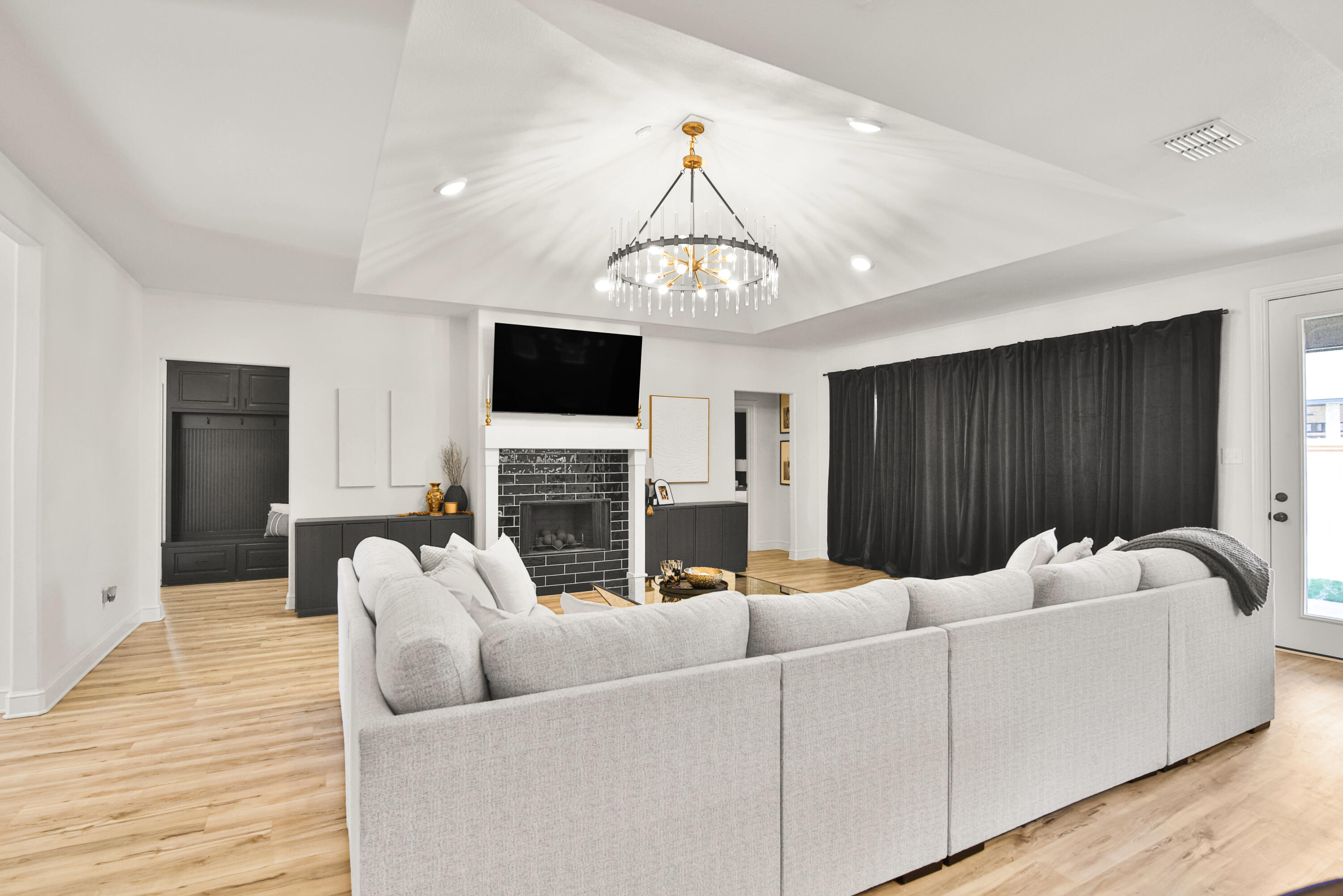 3706 144th Street Lubbock, TX 79423 - Photo 3 of 36 a living room with furniture and a fireplace