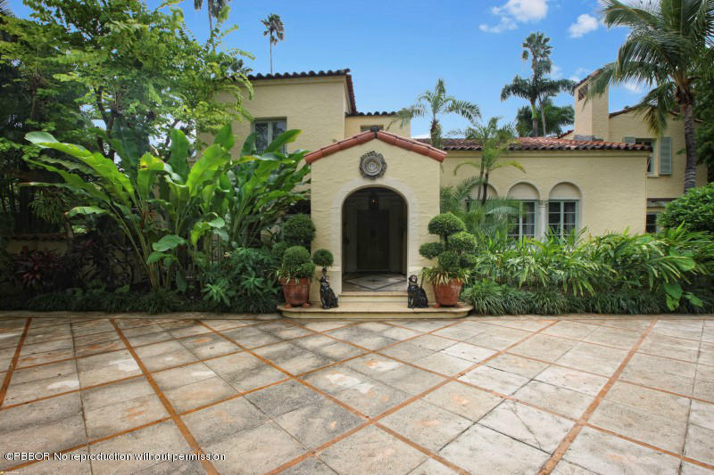 322 Clarke Avenue Palm Beach, FL 33480 - Photo 3 of 28 a front view of a house with garden