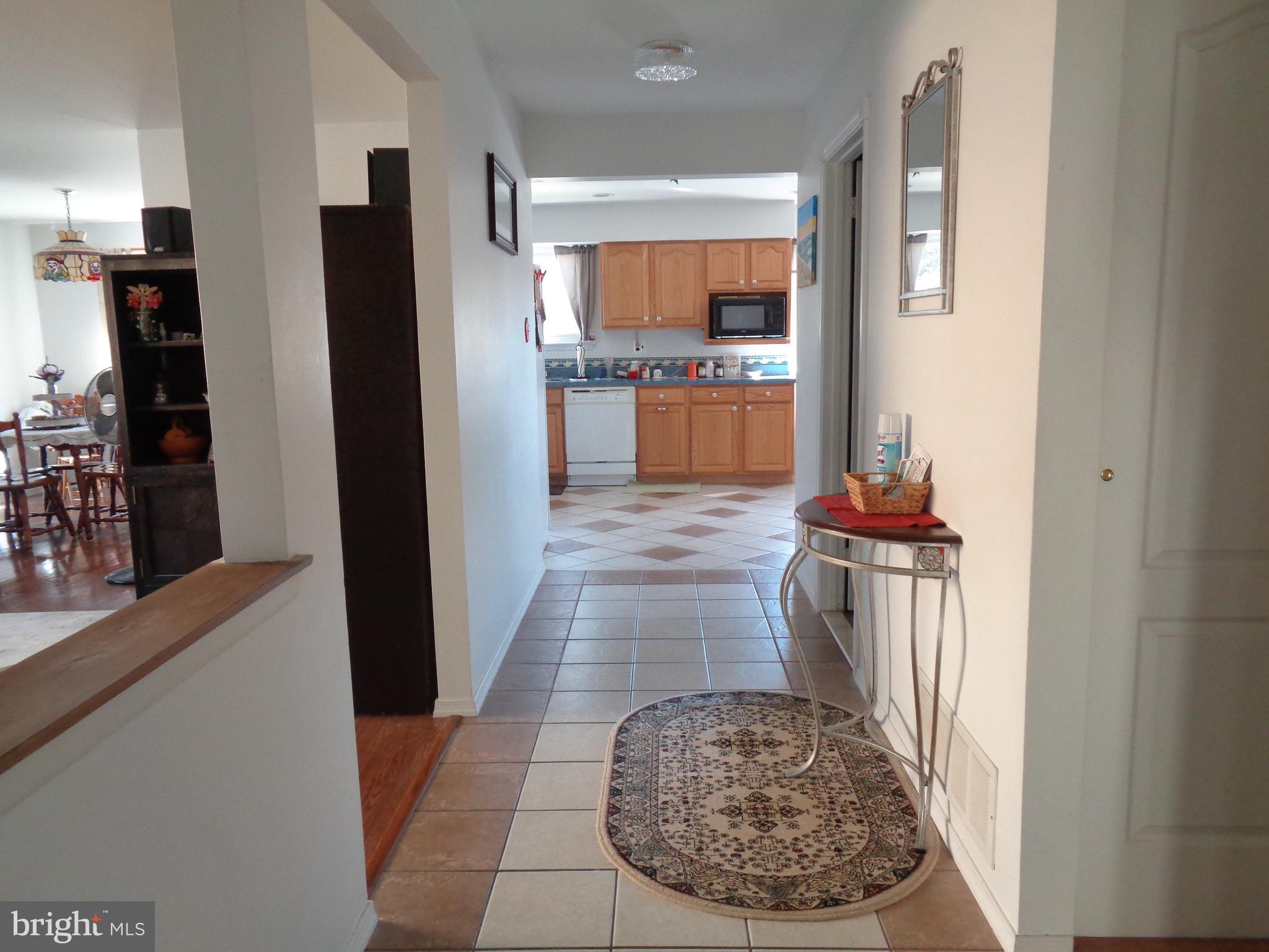 104 Wescott Road Marlton, NJ 08053 - Photo 2 of 21 a kitchen with refrigerator and cabinets