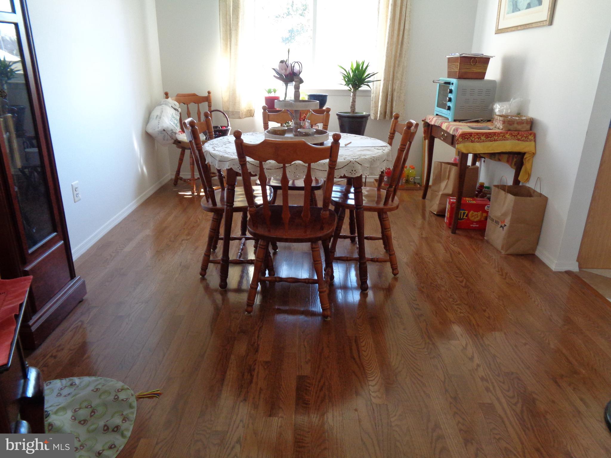 104 Wescott Road Marlton, NJ 08053 - Photo 5 of 21 a view of a dining room with furniture and wooden floor