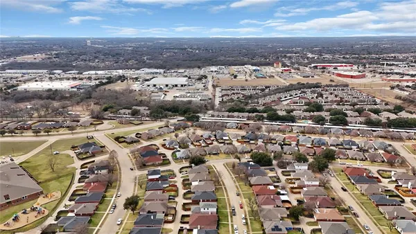 an aerial view of a city with lots of residential buildings