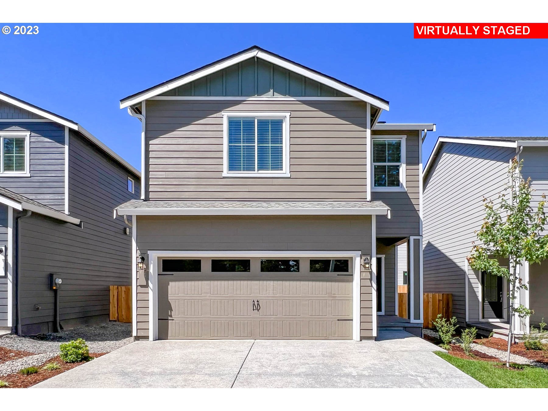 a front view of a house with a yard