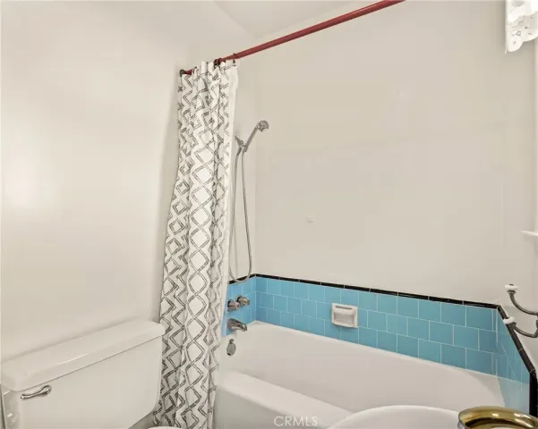 a bathroom with a bathtub and shower