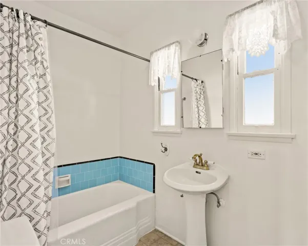 a bathroom with a sink and a bathtub