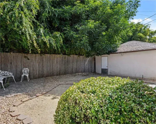 a backyard of a house with green landscape
