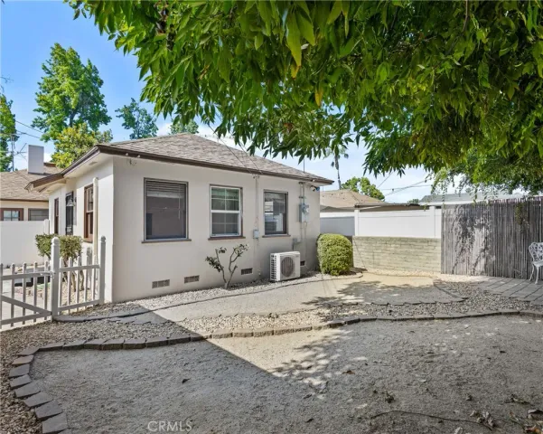 a front view of a house with a yard and a garage