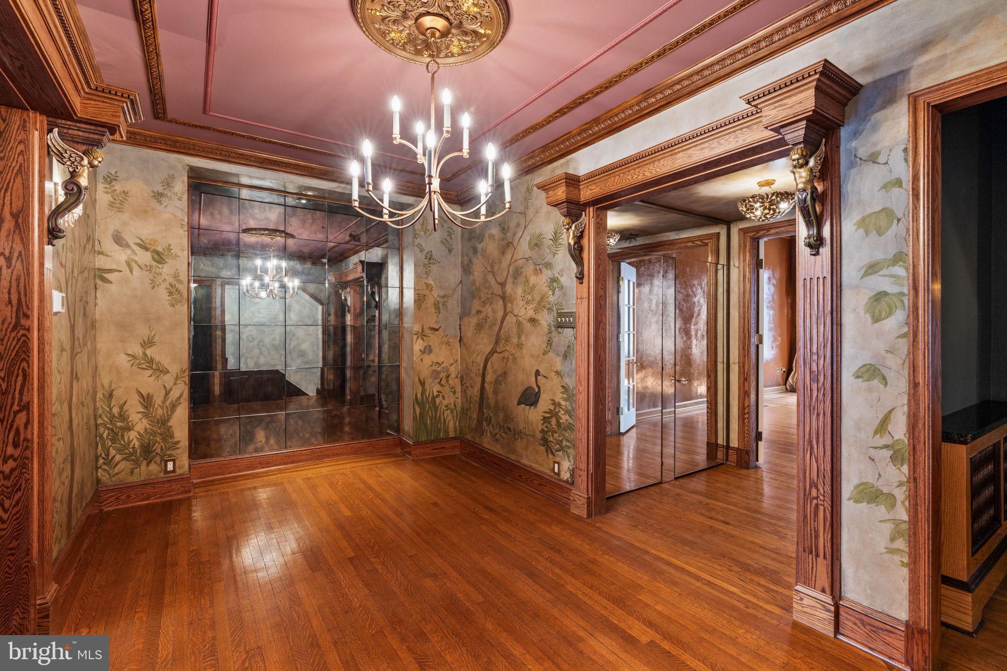 2013 Delancey Place Philadelphia, PA 19103 - Photo 16 of 79 a view of a hallway with wooden floor and chandelier