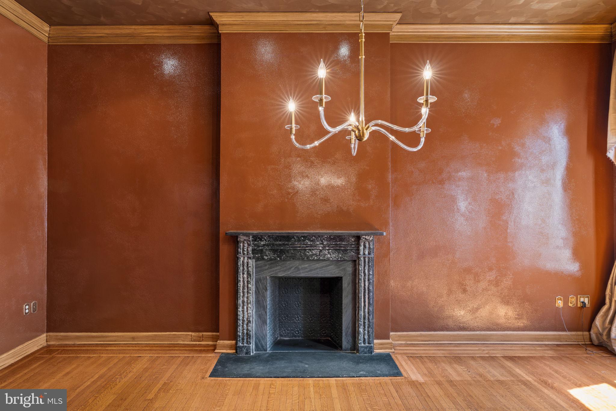 2013 Delancey Place Philadelphia, PA 19103 - Photo 18 of 79 a room with a wooden floor and a fireplace