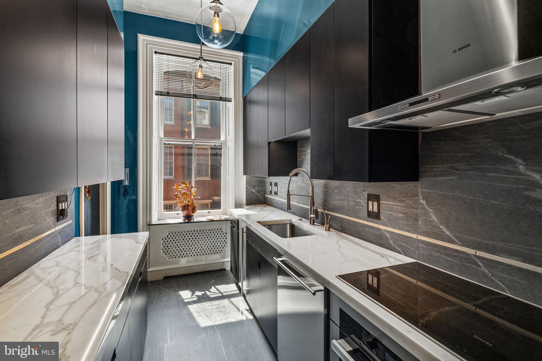 2013 Delancey Place Philadelphia, PA 19103 - Photo 21 of 79 a kitchen with a sink stove and cabinets