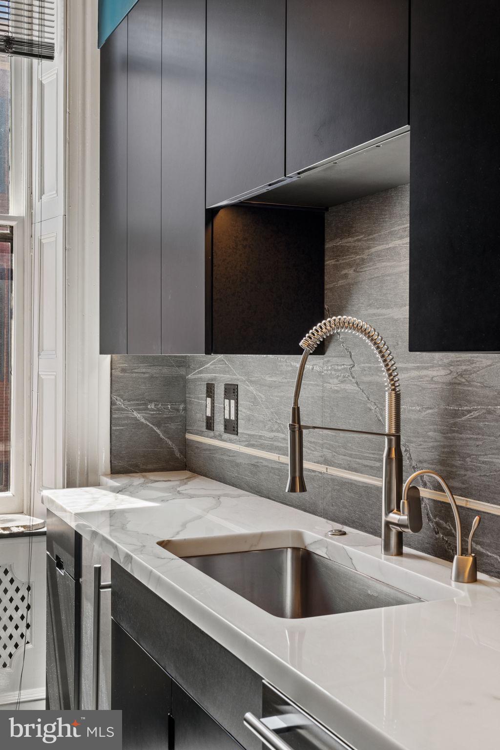 2013 Delancey Place Philadelphia, PA 19103 - Photo 22 of 79 a kitchen with a sink and a microwave