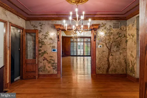 a view of an empty room with a fireplace