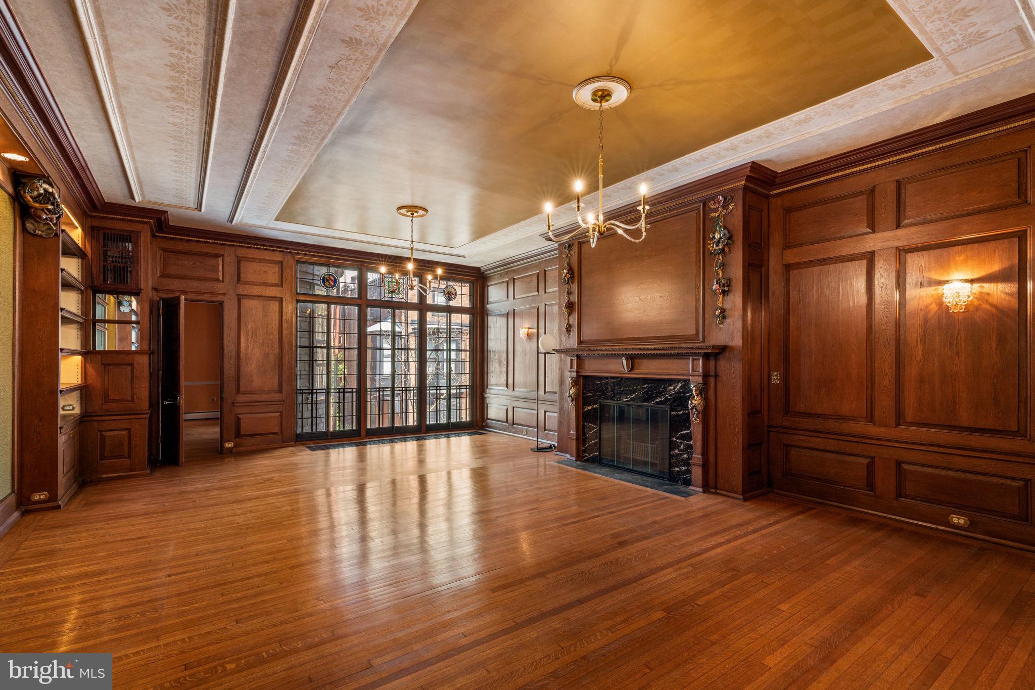 2013 Delancey Place Philadelphia, PA 19103 - Photo 24 of 79 a view of an empty room with a fireplace and a window