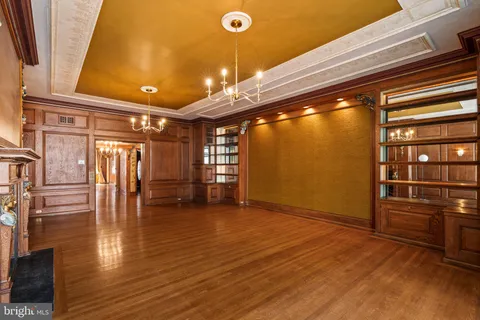 a bathroom with a bathtub and double sink