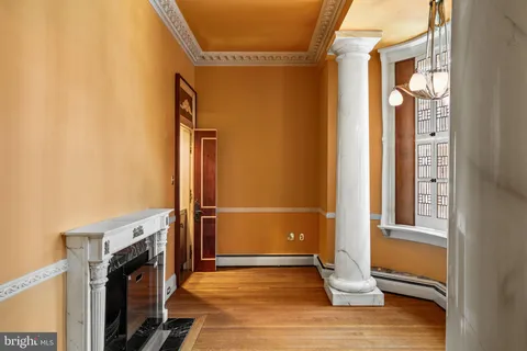 a view of an entryway with wooden floor and door