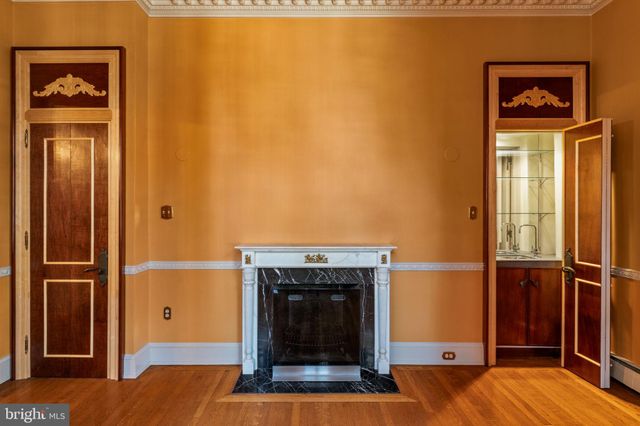 a view of an empty room with empty shelves