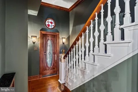 a bathroom with a sink mirror and toilet