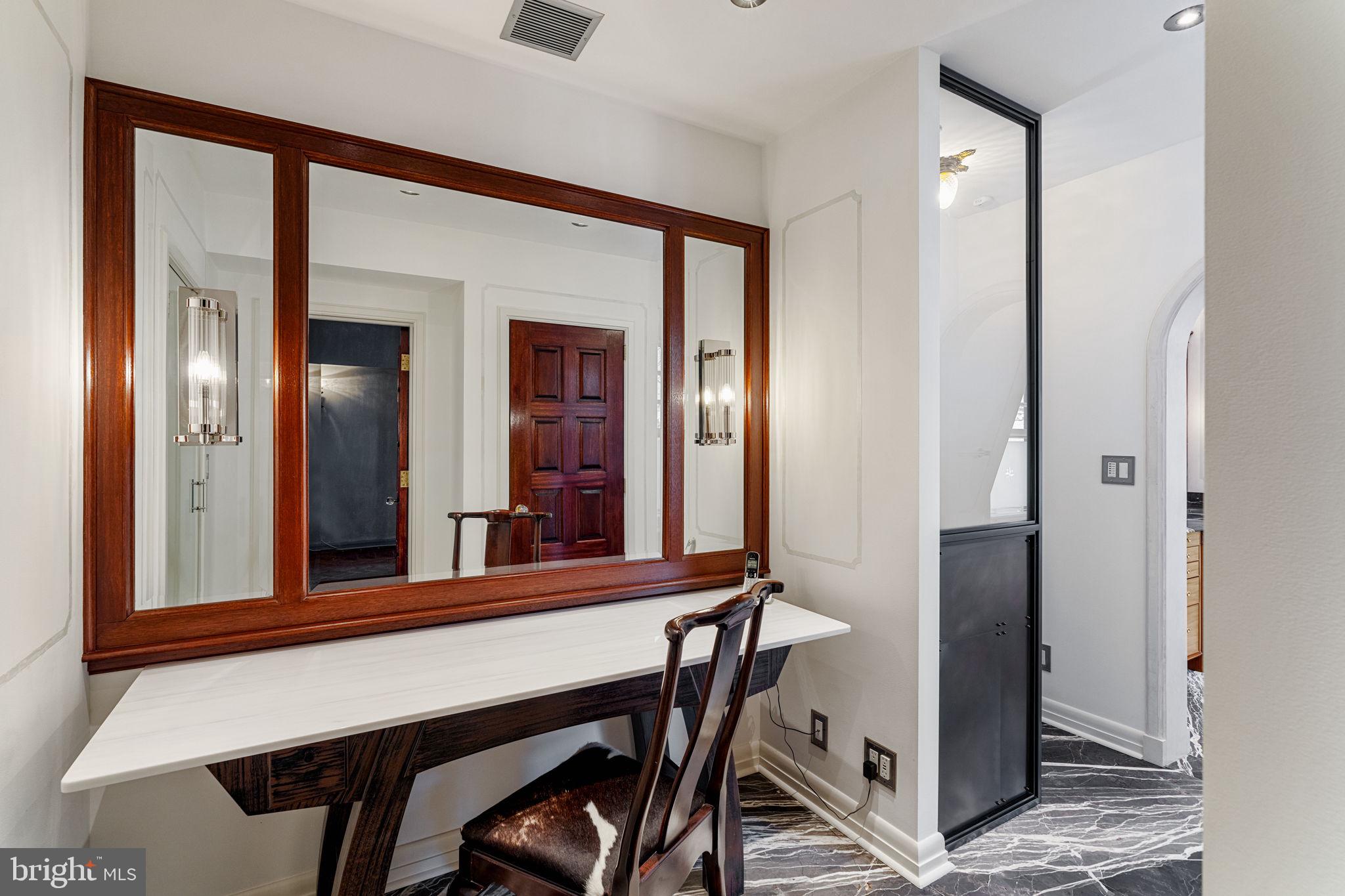 2013 Delancey Place Philadelphia, PA 19103 - Photo 38 of 79 a view of a hallway with a large mirror and entryway