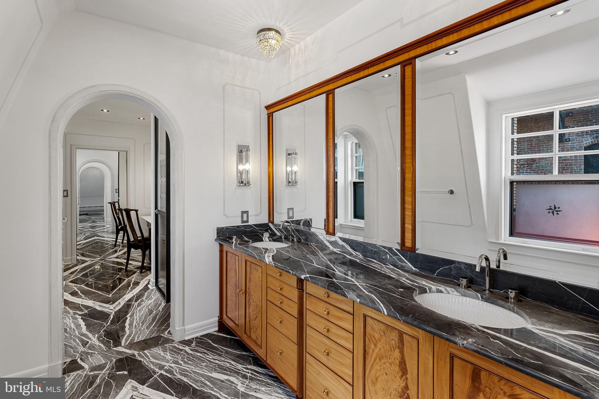 2013 Delancey Place Philadelphia, PA 19103 - Photo 41 of 79 a bathroom with a granite countertop sink and a mirror