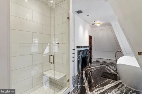 a large kitchen with stainless steel appliances a stove and a refrigerator