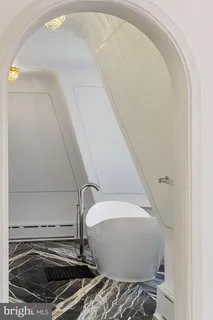 a view of empty room with a fireplace