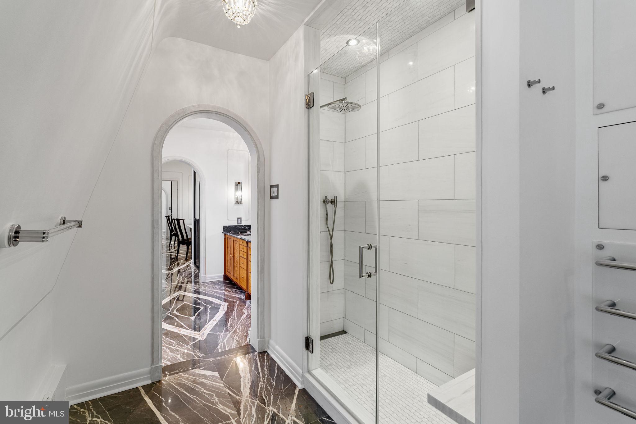 2013 Delancey Place Philadelphia, PA 19103 - Photo 48 of 79 a spacious bathroom with a glass shower door and a bathtub