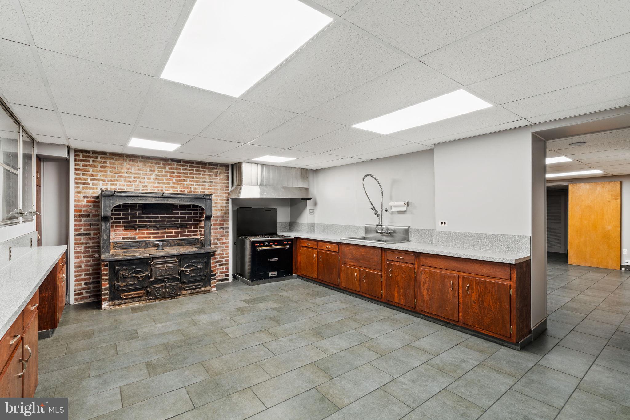 2013 Delancey Place Philadelphia, PA 19103 - Photo 68 of 79 a large kitchen with stainless steel appliances a stove and a refrigerator