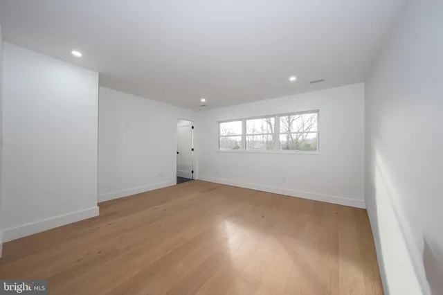 a view of a dresser with wooden floor