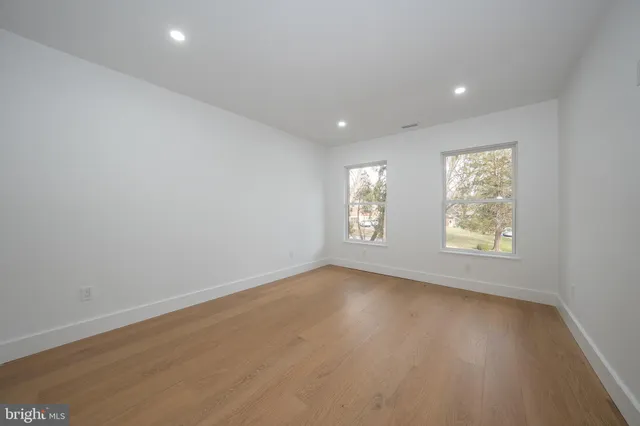 a bathroom with a sink toilet a mirror and shower