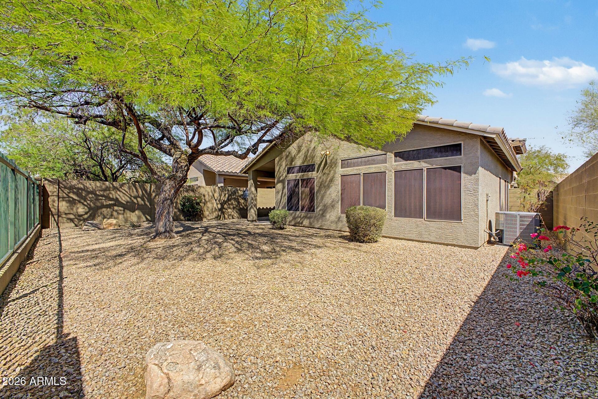 40602 North Apollo Way Anthem, AZ 85086 - Photo 37 of 38 a front view of a house with a yard