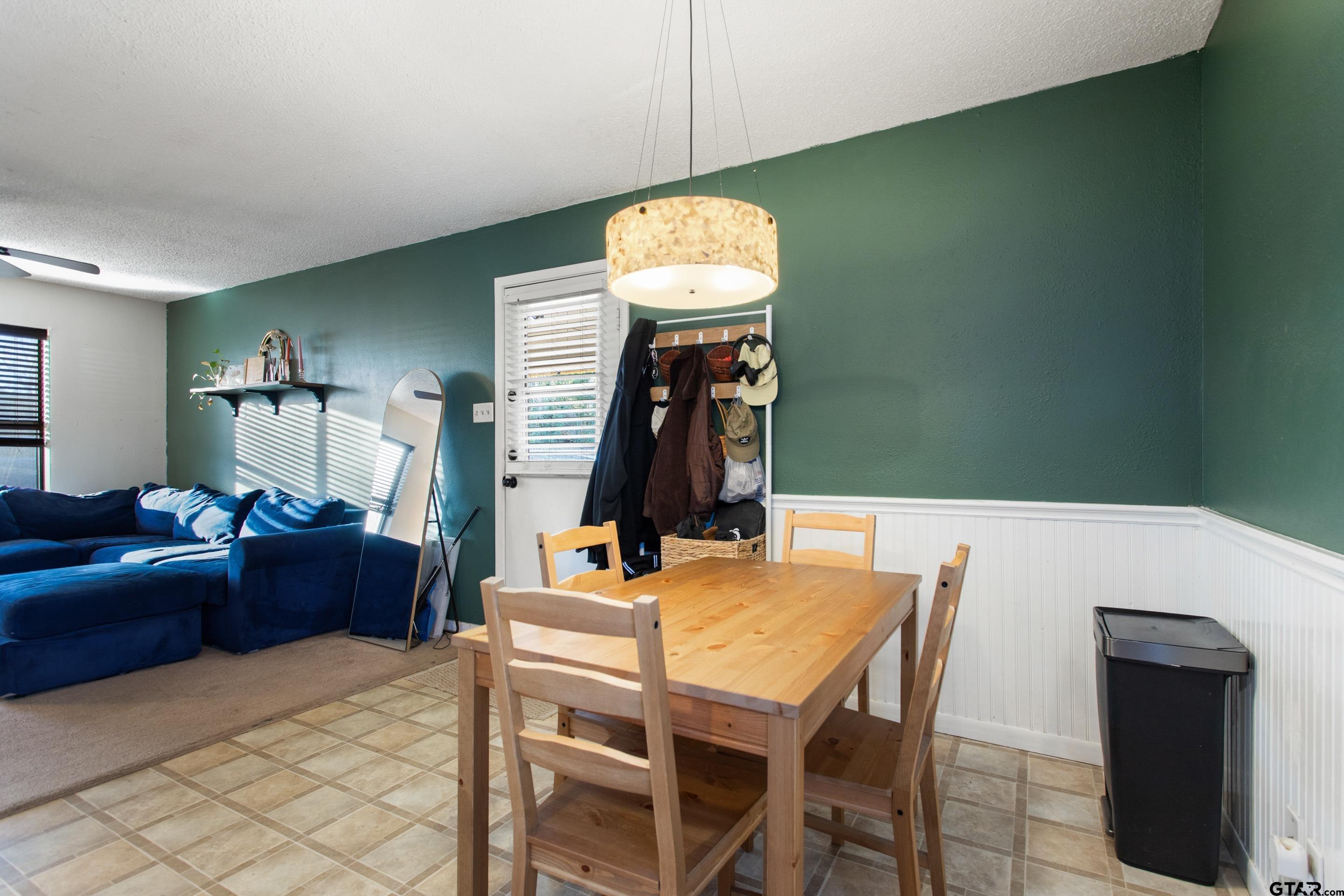 1106 Brad Circle Lindale, TX 75771 - Photo 11 of 27 a view of a dining room with furniture and wooden floor