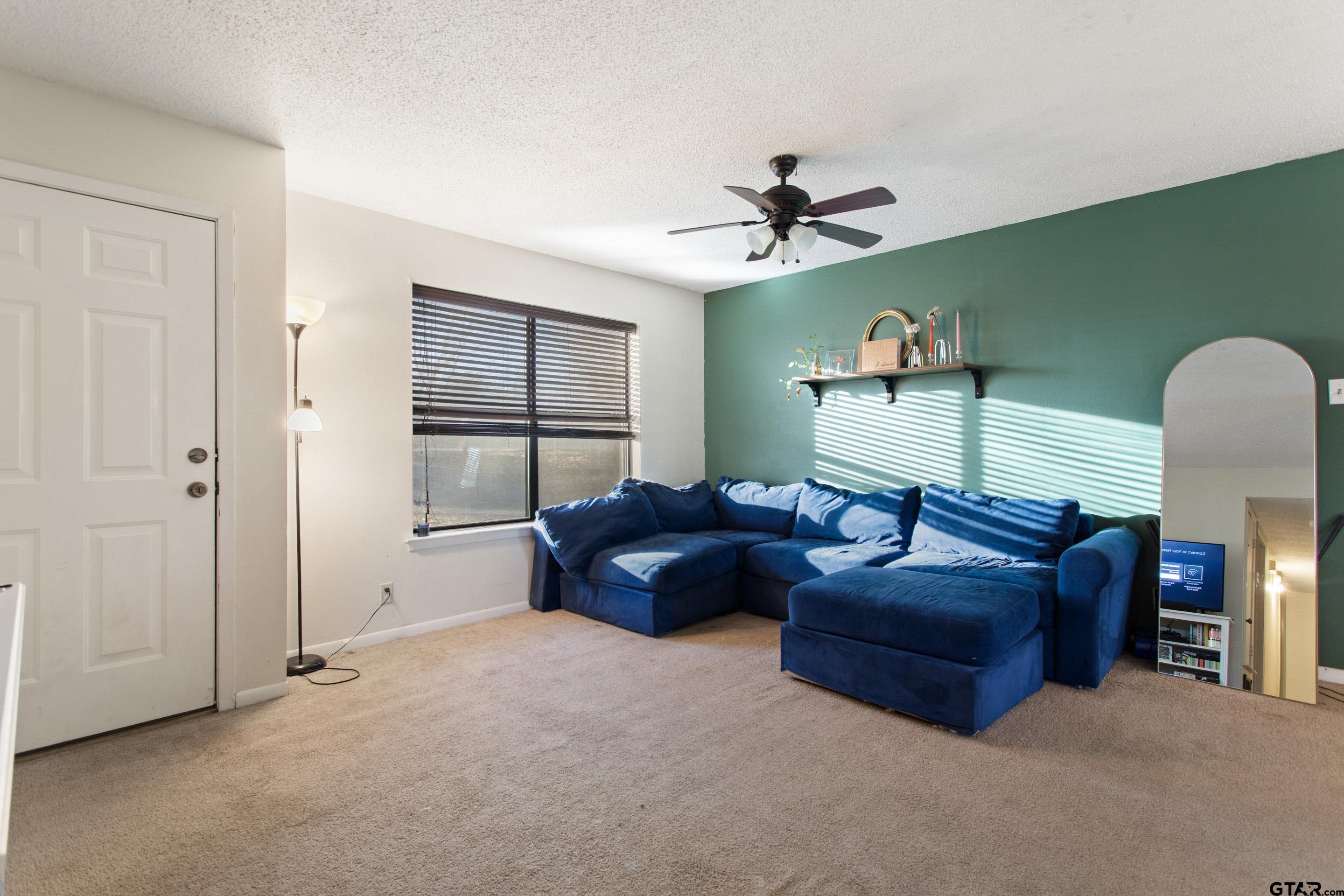 1106 Brad Circle Lindale, TX 75771 - Photo 14 of 27 a living room with furniture and a window