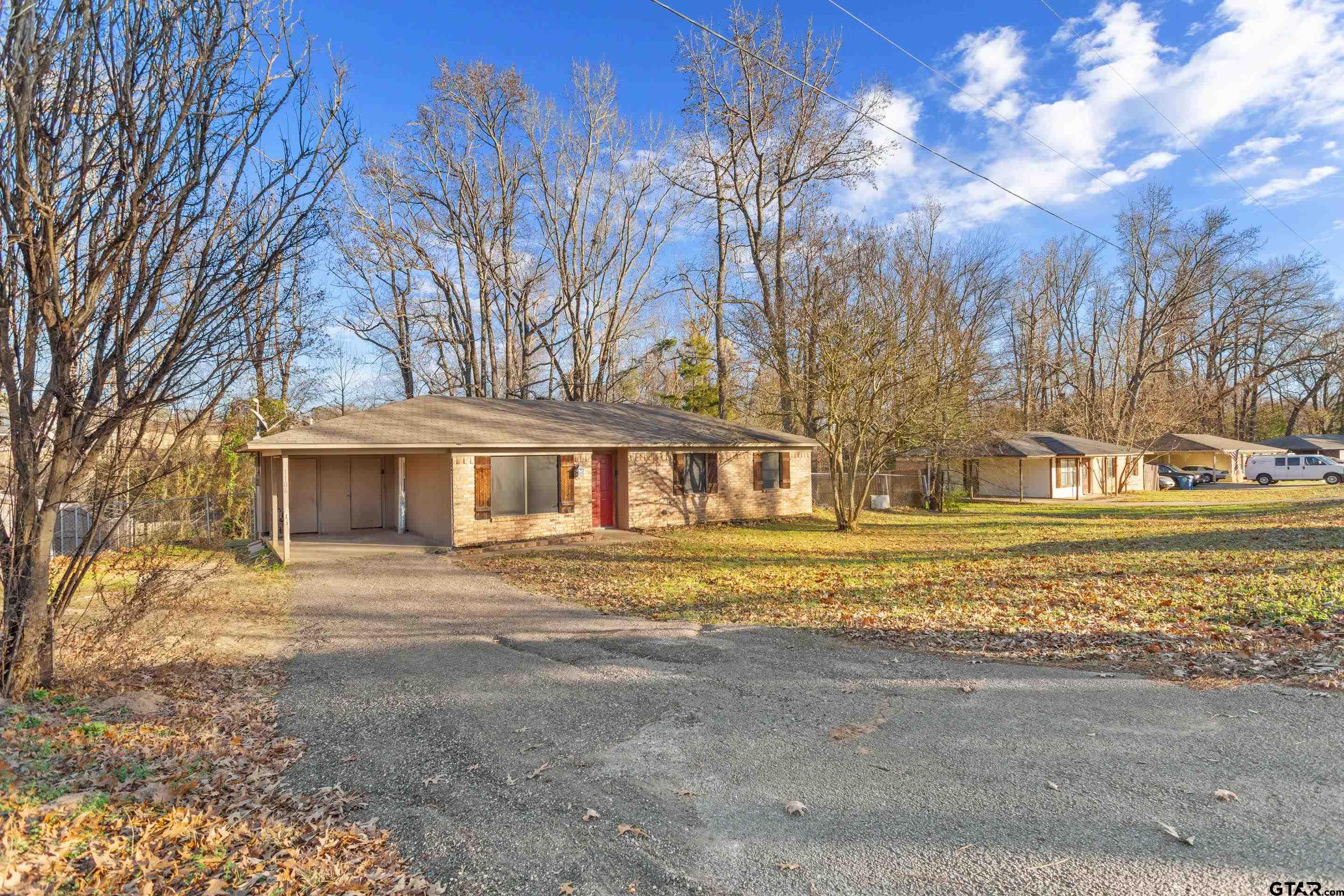 1106 Brad Circle Lindale, TX 75771 - Photo 18 of 27 a front view of a house with a garden