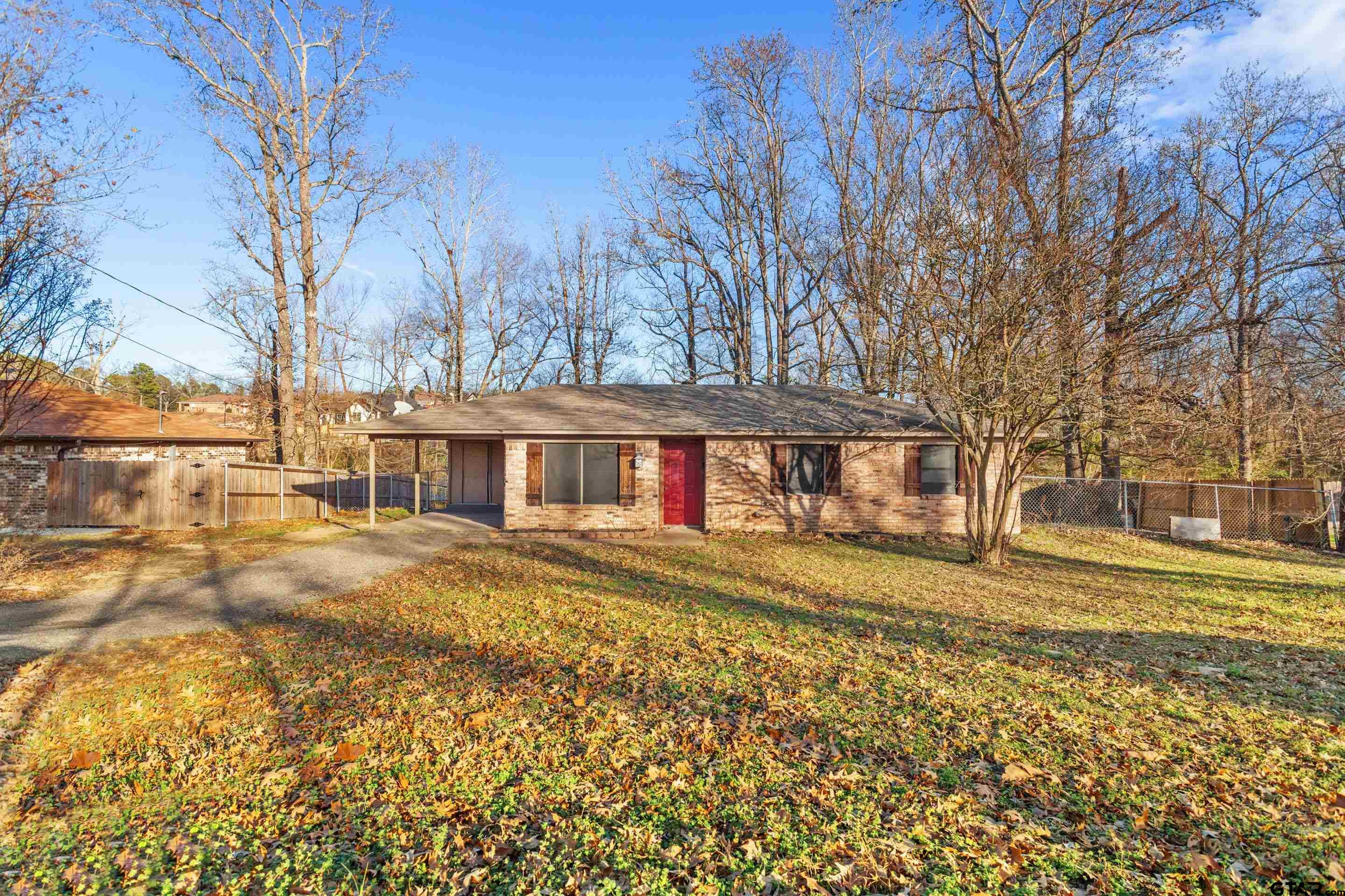 1106 Brad Circle Lindale, TX 75771 - Photo 5 of 27 a view of a large house with a big yard and large trees
